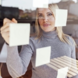 Business woman reviewing financial dashboards in NetSuite ERP after implementation.