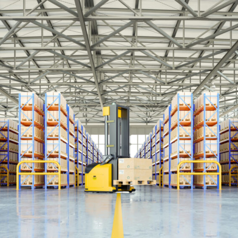 Modern warehouse with automated forklift and organised shelving, representing an advanced warehouse management system in Ireland for wholesale distributors.