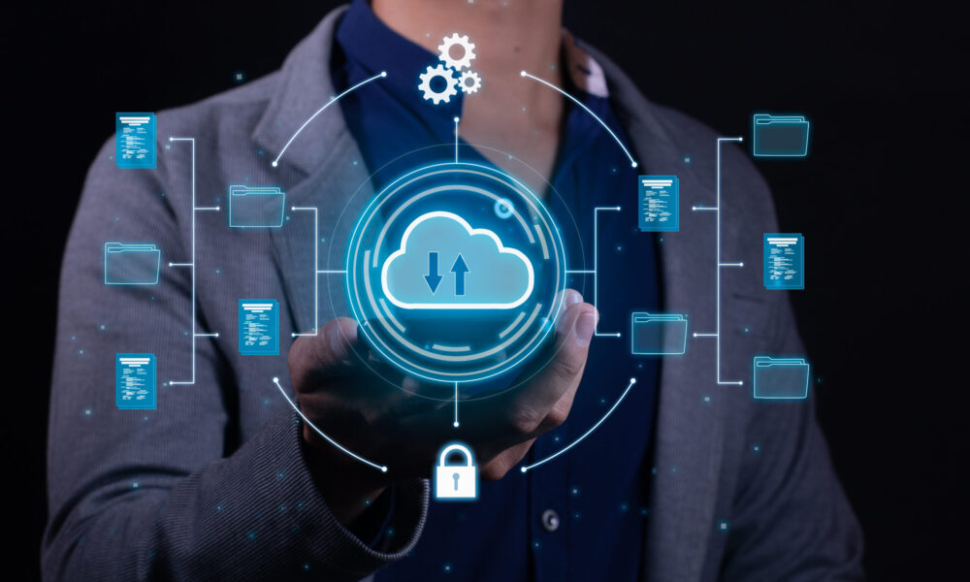 Business professional holding a glowing cloud computing icon with connected file folders and security symbols, representing a move from Xero to NetSuite cloud ERP.