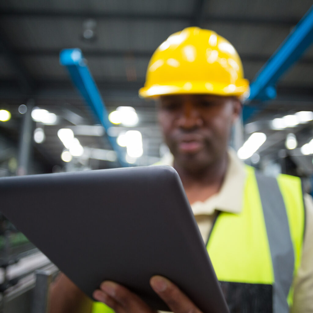 close-up-of-factory-worker-using-digital-tablet-in-production-setting-netsuite-erp