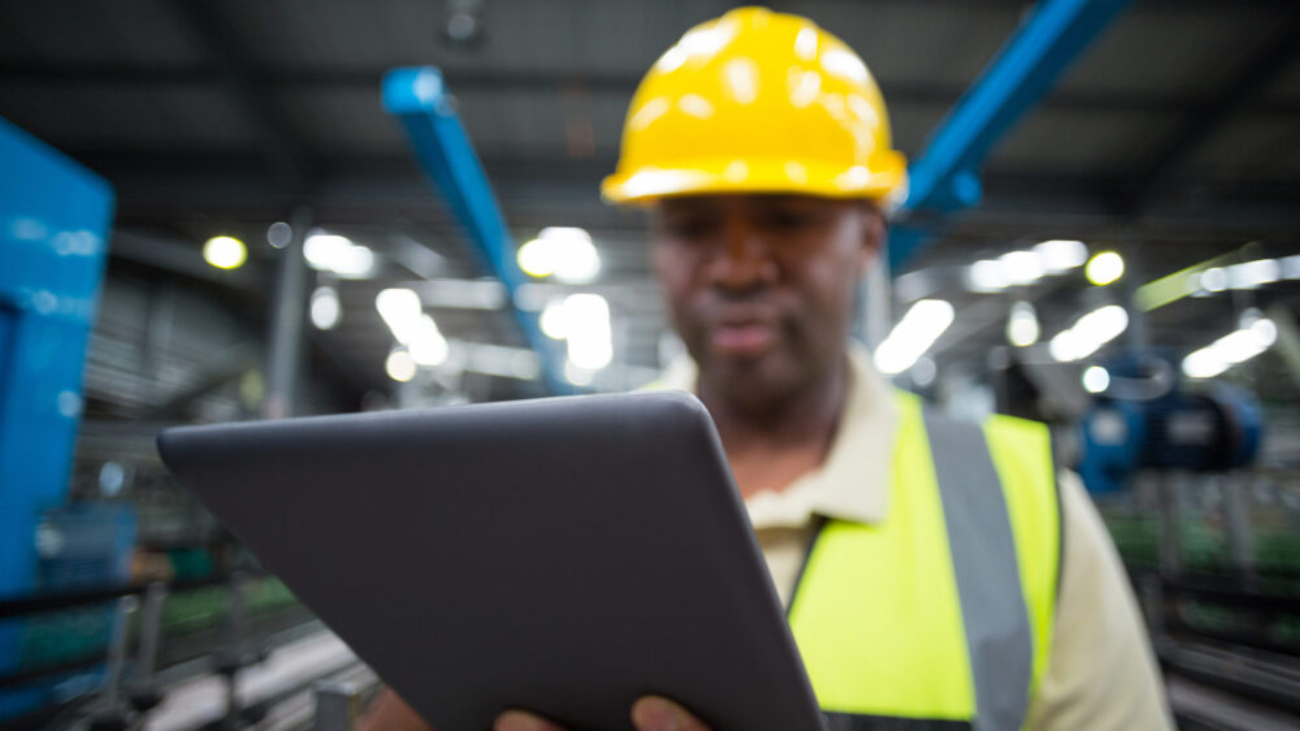 close-up-of-factory-worker-using-digital-tablet-in-production-setting-netsuite-erp