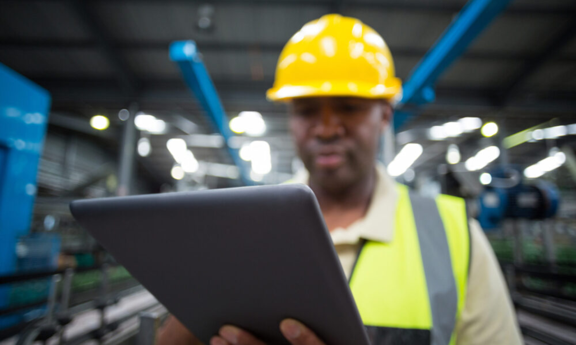 close-up-of-factory-worker-using-digital-tablet-in-production-setting-netsuite-erp