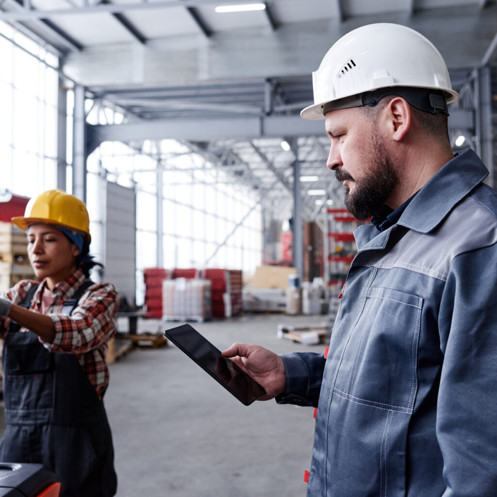 Foreman using a tablet, showing the best field service management software for small business
