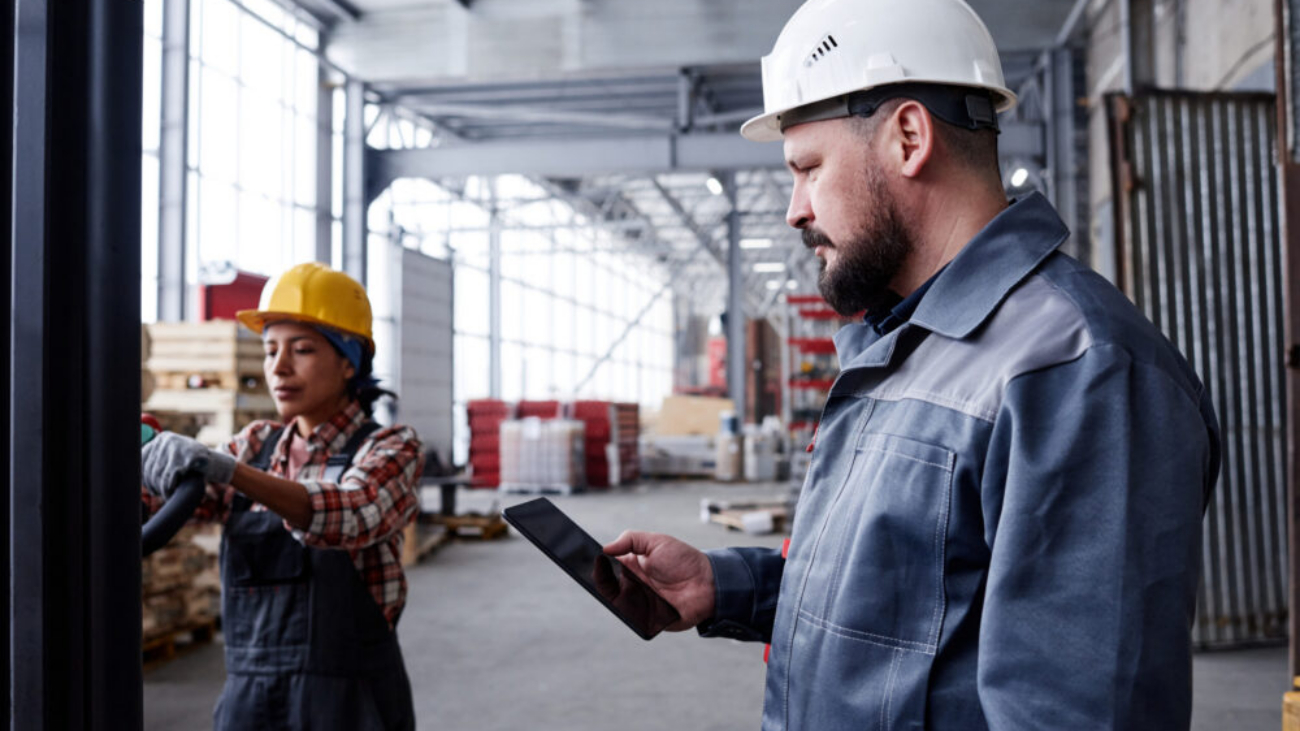 Foreman using a tablet, showing the best field service management software for small business