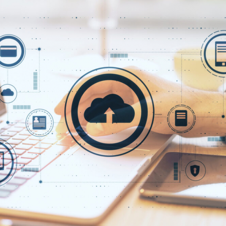 Cloud computing concept with laptop and tablet showing cloud ERP software dashboard for growing small businesses
