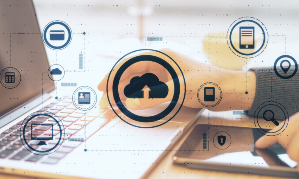 Cloud computing concept with laptop and tablet showing cloud ERP software dashboard for growing small businesses