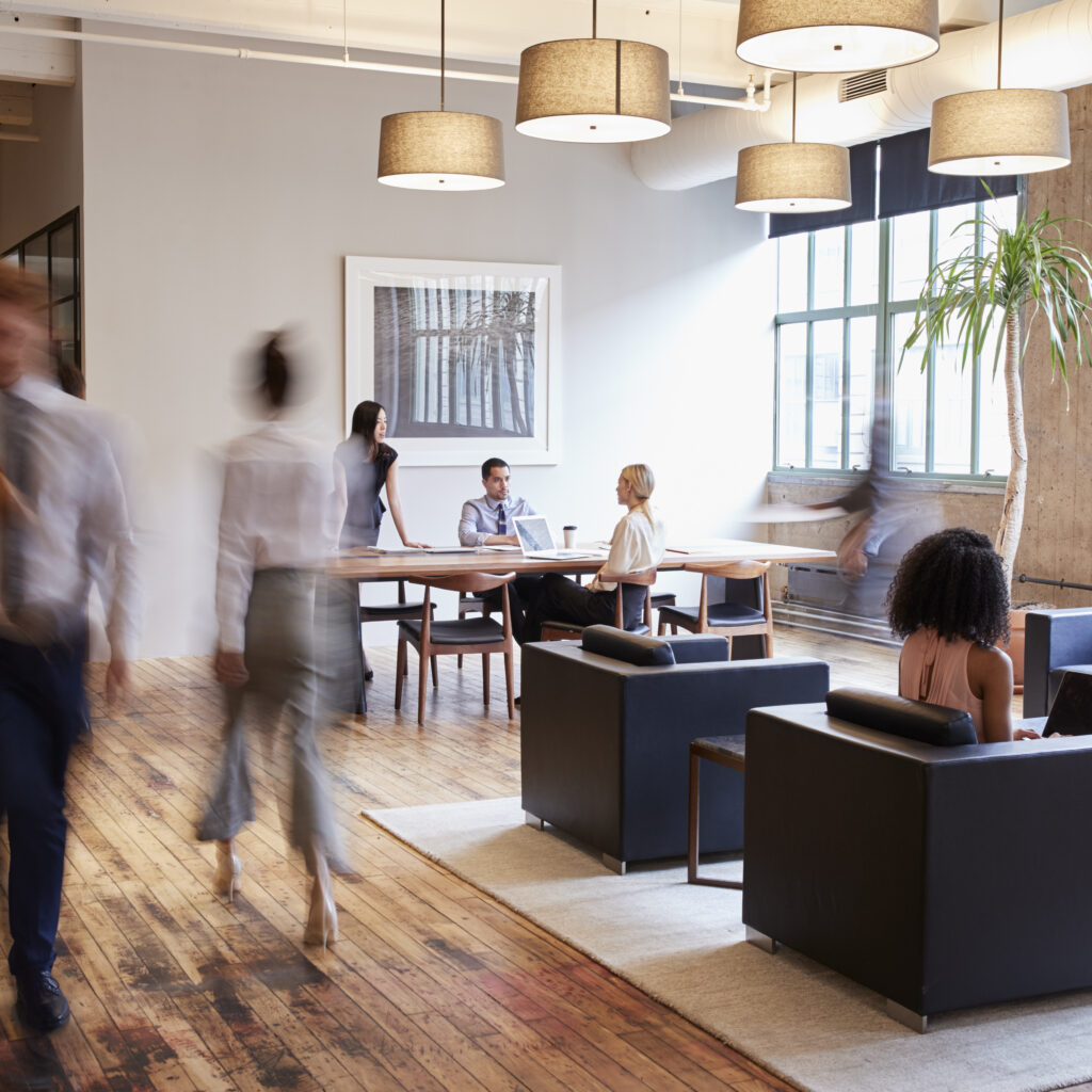 Business professionals collaborating in a modern luxury office using NetSuite Ireland to support multi-entity business growth.